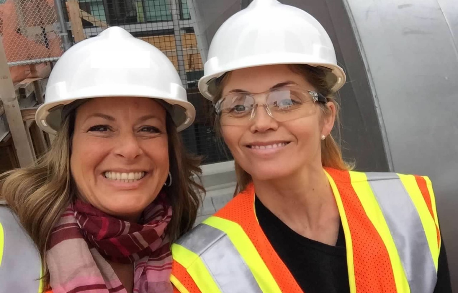 Two Fairfield associates wearing hard hats on a construction tour