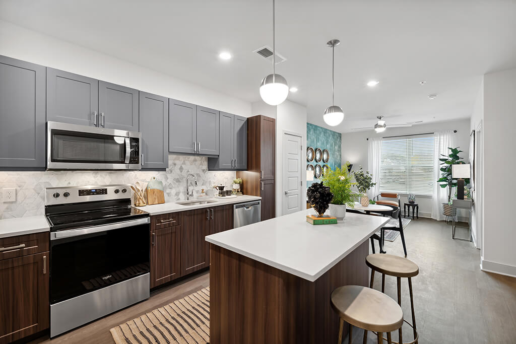 High-end kitchen with stainless steel appliances at The Belhaven Apartments.