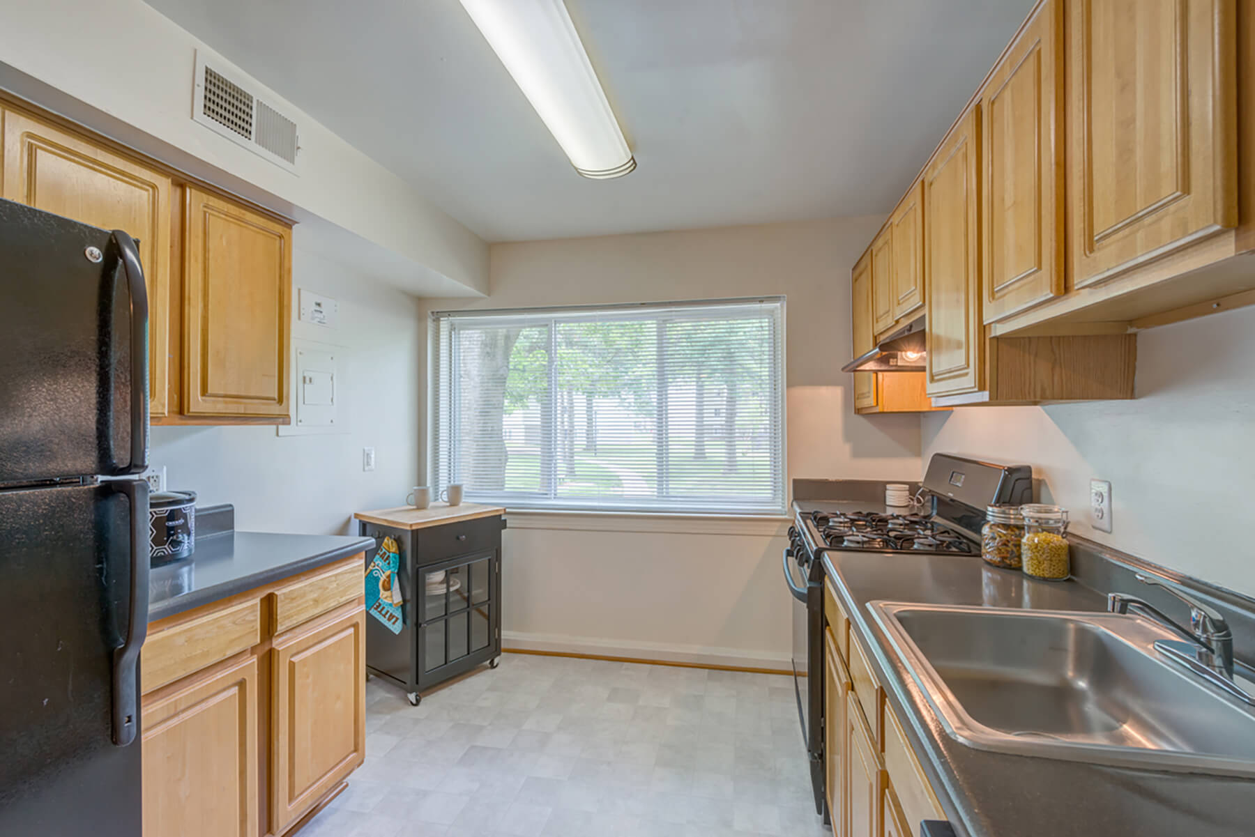 A kitchen with a double sink at the Leesburg Apartments in Leesburg, Virginia.