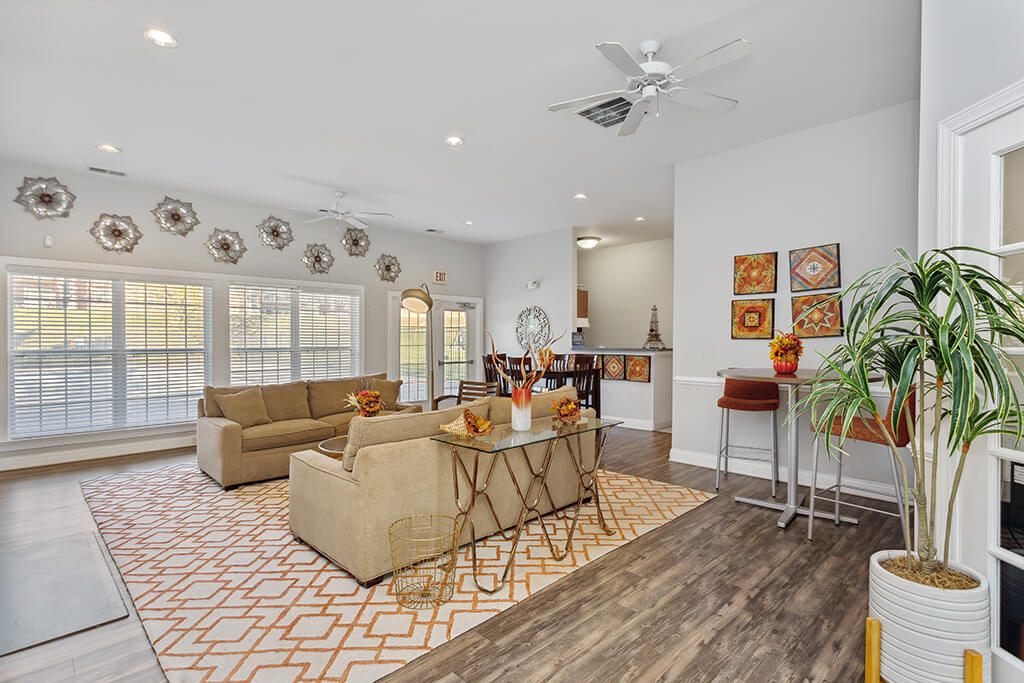 A modern, spacious living room at the Weston Circle and Wicklow Square Apartments in Fredericksburg, Virginia.