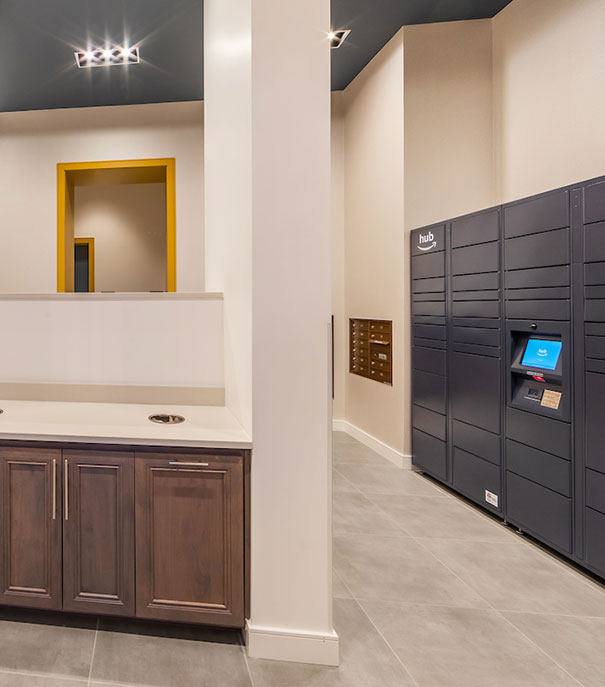 Electronic package lockers, known as Amazon Hubs, on the right are conveniently located in the mail room inside a Fairfield community.