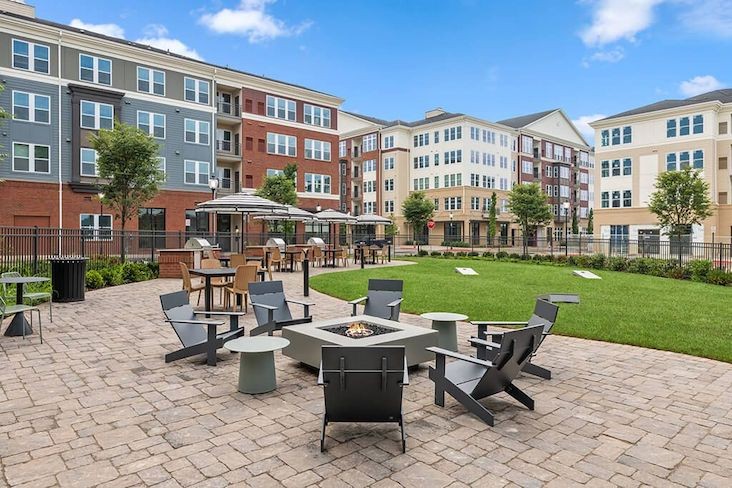 The Moxley Apartments courtyard fireside lounge area