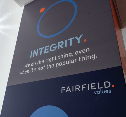 Breakroom pillar decorated with the Fairfield core values.
